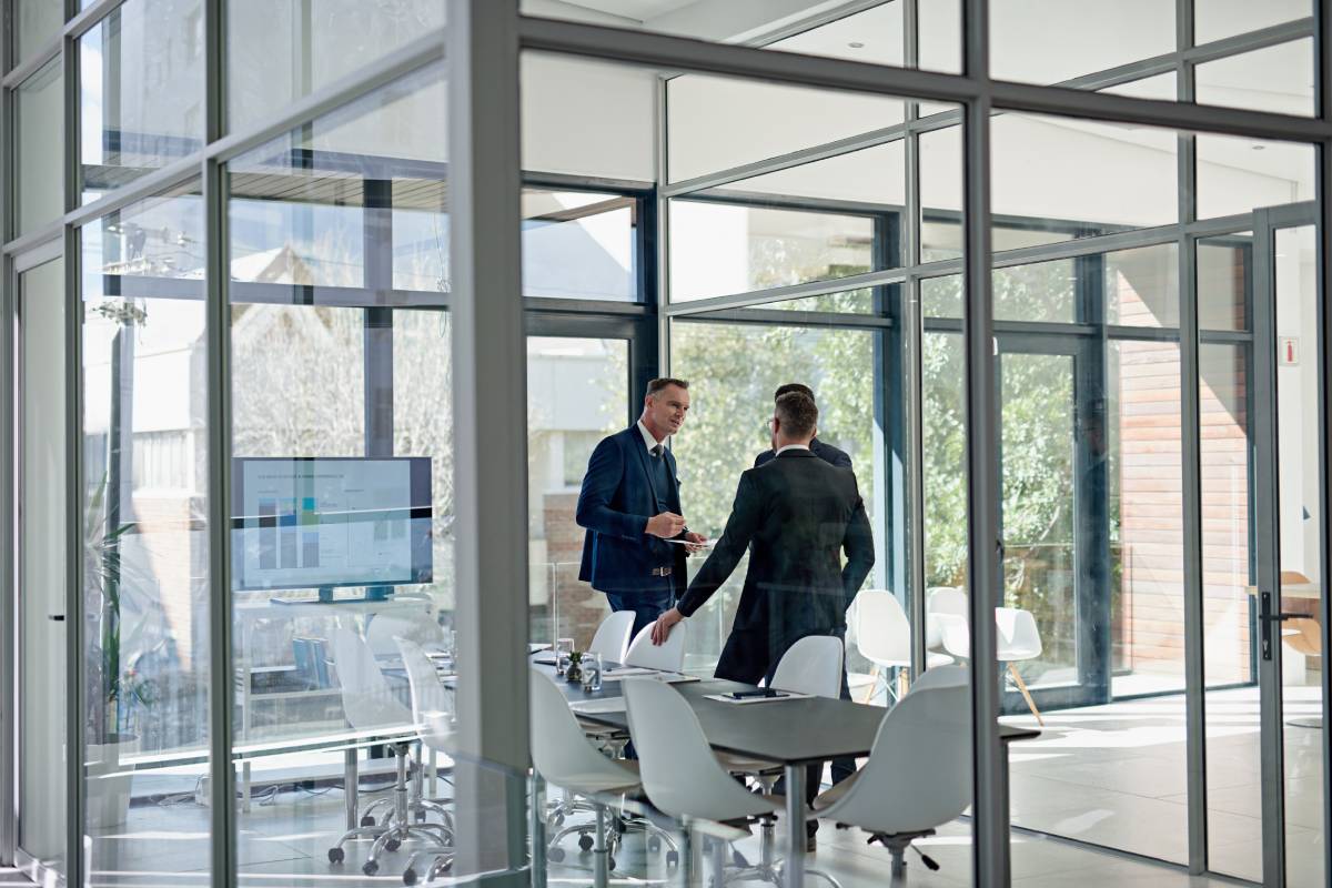 aluminium partition. Shot of corporate businesspeople meeting in the boardroom