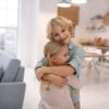 Boy and girl smiling and embracing each other