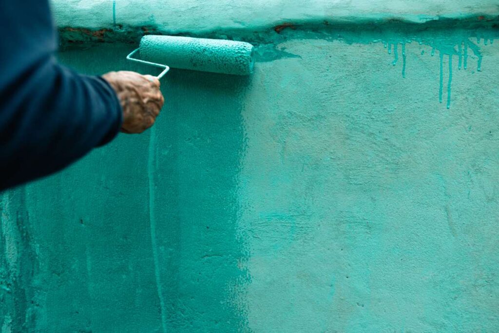 Paint the fence wall in summer bright blue.,Painting and home renovation